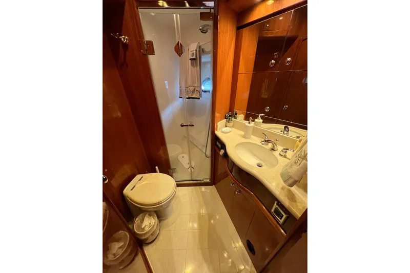 Bucephulas Yacht Photos Pics Luxurious bathroom in 2012 Hampton motor yacht with modern fixtures and elegant wood finishes.
