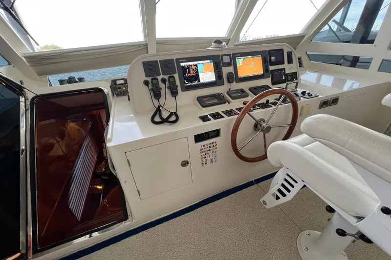 Bucephulas Yacht Photos Pics Helm of 2012 Hampton motor yacht with navigation screens and steering wheel.