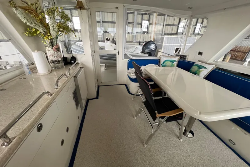 Bucephulas Yacht Photos Pics Luxurious 2012 Hampton motor yacht interior with dining area and modern amenities.