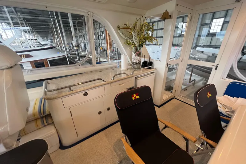 Bucephulas Yacht Photos Pics Luxurious 2012 Hampton motor yacht interior with kitchenette and seating area.