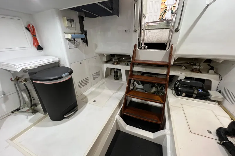 Bucephulas Yacht Photos Pics Engine room of 2012 Hampton motor yacht with wooden stairs and equipment.