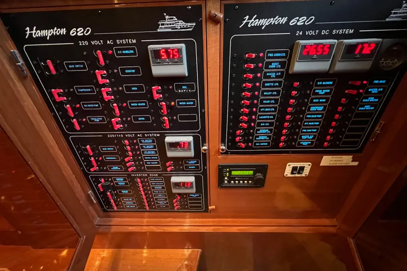 Bucephulas Yacht Photos Pics Control panel of a 2012 Hampton Motor Yacht, featuring AC and DC systems.