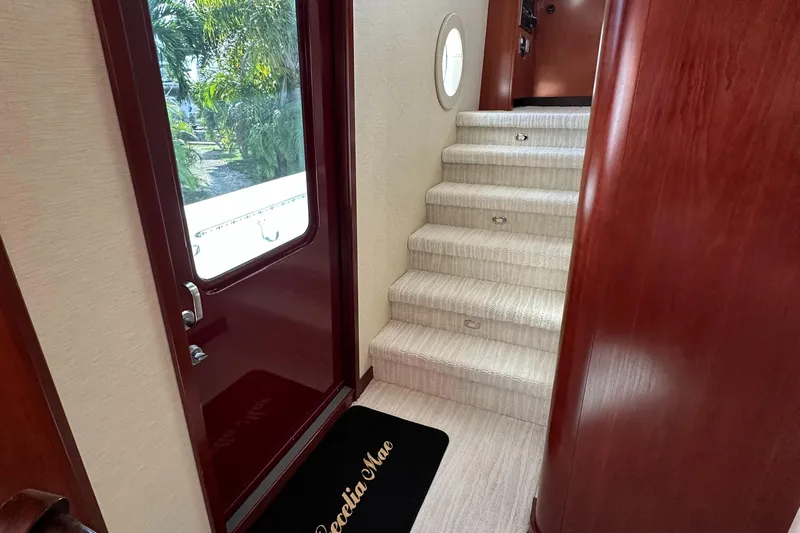 Cecelia Mae Yacht Photos Pics Interior stairs and door of 2015 Broward Raised Pilothouse M/Y yacht.