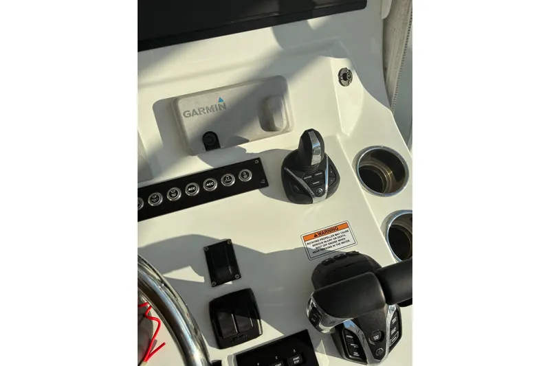  Yacht Photos Pics 2024 Contender 39 ST boat dashboard with Garmin controls and cup holders.