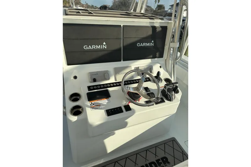  Yacht Photos Pics 2024 Contender 39 ST boat console with Garmin navigation displays and steering wheel.