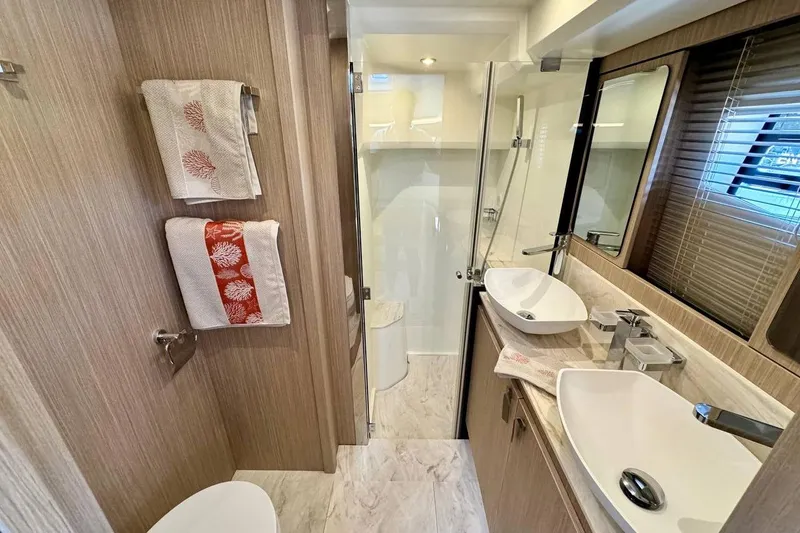  Yacht Photos Pics Luxurious bathroom in 2026 Prestige F4.9 yacht, featuring modern fixtures and elegant design.