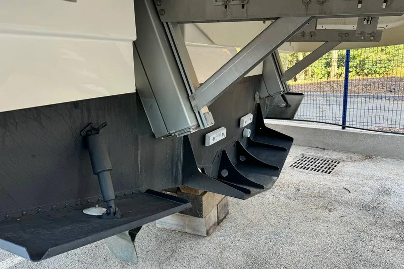  Yacht Photos Pics Rear view of a 2026 Prestige F4.9 boat showing trim tabs and hydraulic components.