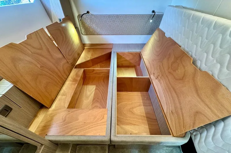  Yacht Photos Pics Open wooden storage compartments in a 2026 Prestige F4.9 interior.