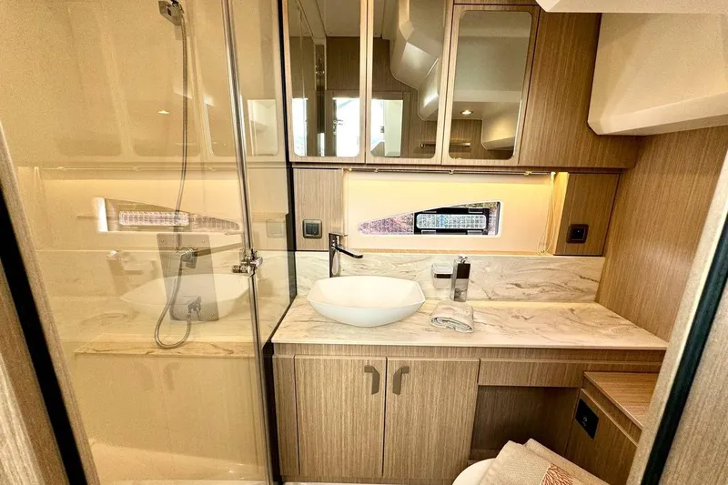  Yacht Photos Pics Luxurious bathroom in 2026 Prestige F4.9 yacht with modern fixtures and elegant design.