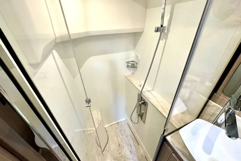  Yacht Photos Pics Modern shower area in 2026 Prestige F4.9, featuring sleek design and glass enclosure.