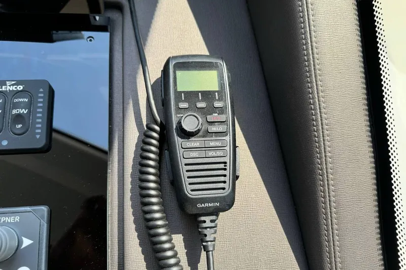  Yacht Photos Pics Handheld Garmin radio on a Prestige F4.9 boat dashboard, 2026 model.