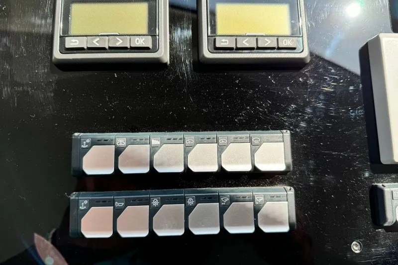  Yacht Photos Pics Control panel of a 2026 Prestige F4.9 with buttons and digital displays.