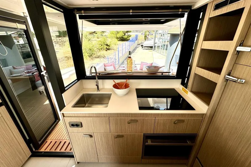  Yacht Photos Pics Modern kitchen interior on Prestige F4.9 yacht, featuring sleek design and ample natural light.