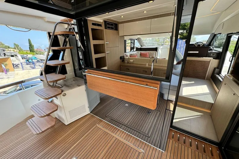  Yacht Photos Pics Luxurious Prestige F4.9 yacht interior, 2026 model, featuring elegant wood finishes and modern design.