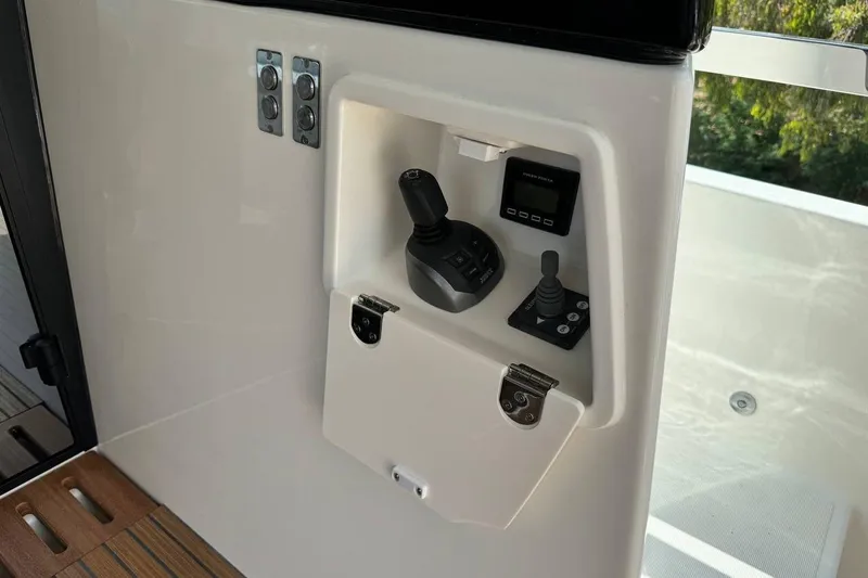 Yacht Photos Pics Control panel of 2026 Prestige F4.9 yacht with joysticks and display.