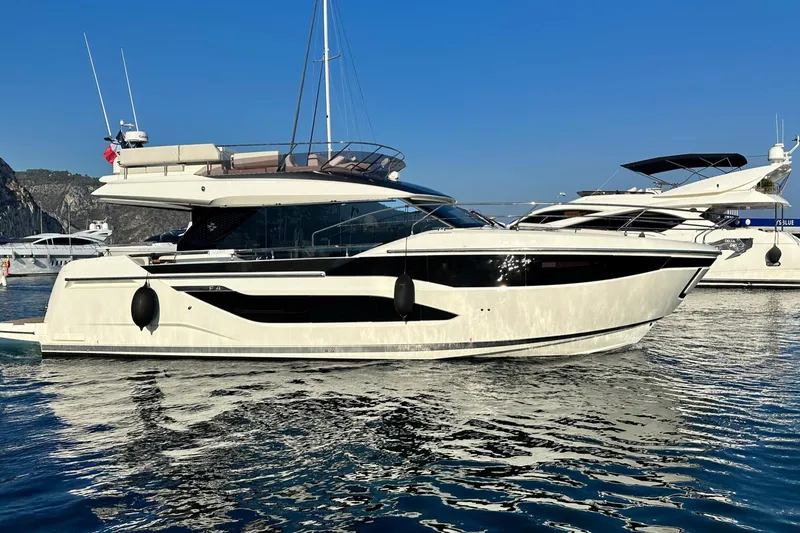  Yacht Photos Pics Luxury yacht Prestige F4.9, 2026 model, docked in a serene marina setting.