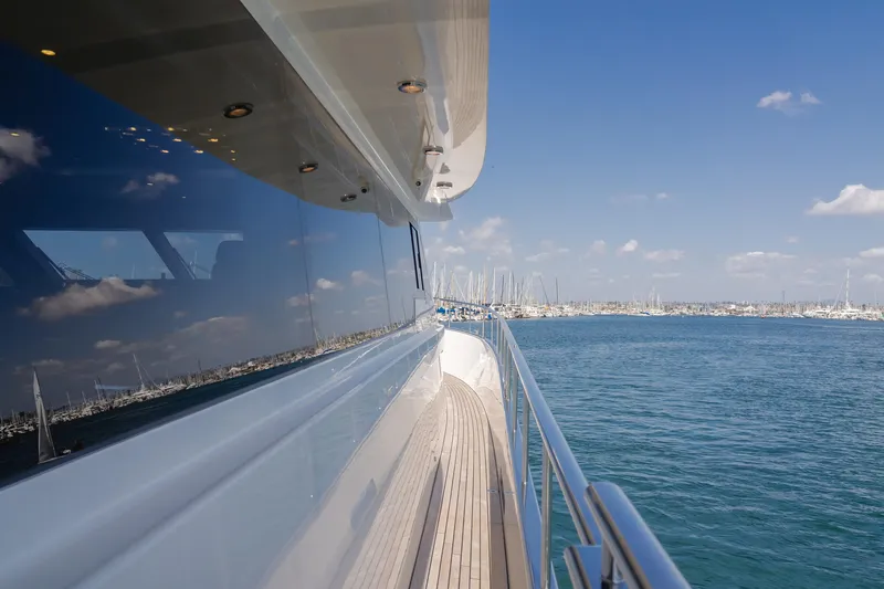 Gyrfalcon Yacht Photos Pics 2016 Van der Valk 78 Flybridge Motor Yacht on the water with marina in the background.