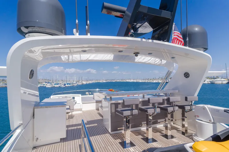 Gyrfalcon Yacht Photos Pics Flybridge of 2016 Van der Valk 78 Motor Yacht with bar stools and ocean view.