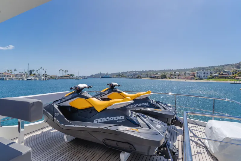 Gyrfalcon Yacht Photos Pics Two Sea-Doo jet skis on the deck of a 2016 Van der Valk 78 Flybridge Motor Yacht.