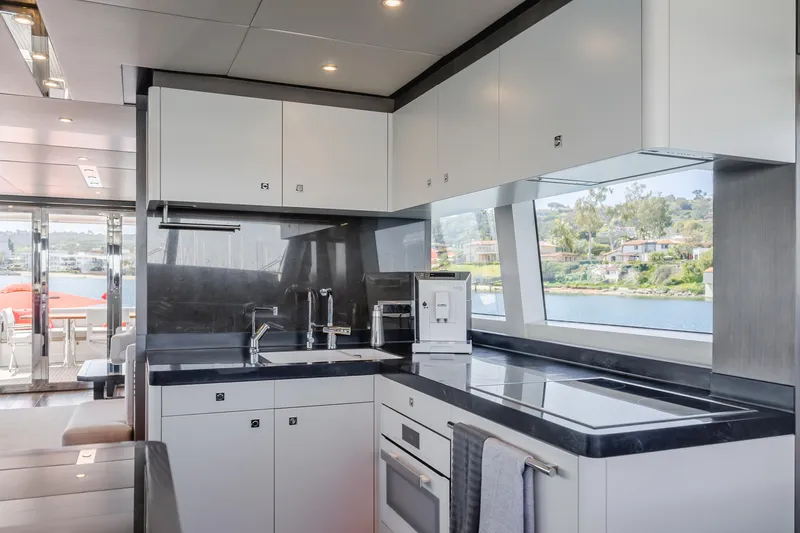 Gyrfalcon Yacht Photos Pics Modern kitchen on 2016 Van der Valk 78 Flybridge Motor Yacht with sleek countertops.