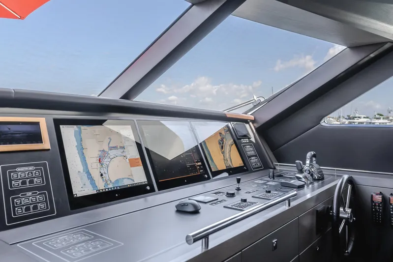 Gyrfalcon Yacht Photos Pics Helm station of 2016 Van der Valk 78 Flybridge Motor Yacht with navigation screens.