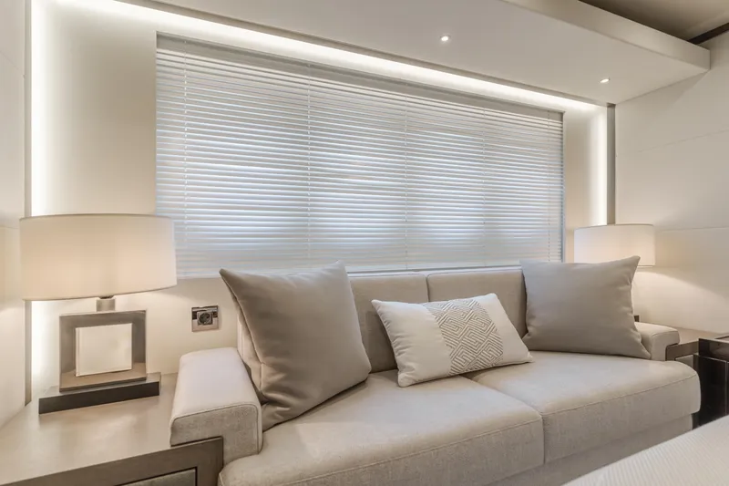 Gyrfalcon Yacht Photos Pics Luxurious interior of 2016 Van der Valk 78 Flybridge Motor Yacht with modern sofa and lamps.