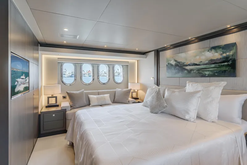 Gyrfalcon Yacht Photos Pics Luxurious bedroom on 2016 Van der Valk 78 Flybridge Motor Yacht with ocean view portholes.