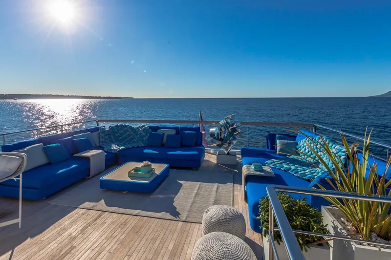 Sanlorenzo Sl118 Yacht Photos Pics Luxurious 2021 Sanlorenzo SL118 yacht deck with blue seating, ocean view, and sunny sky.