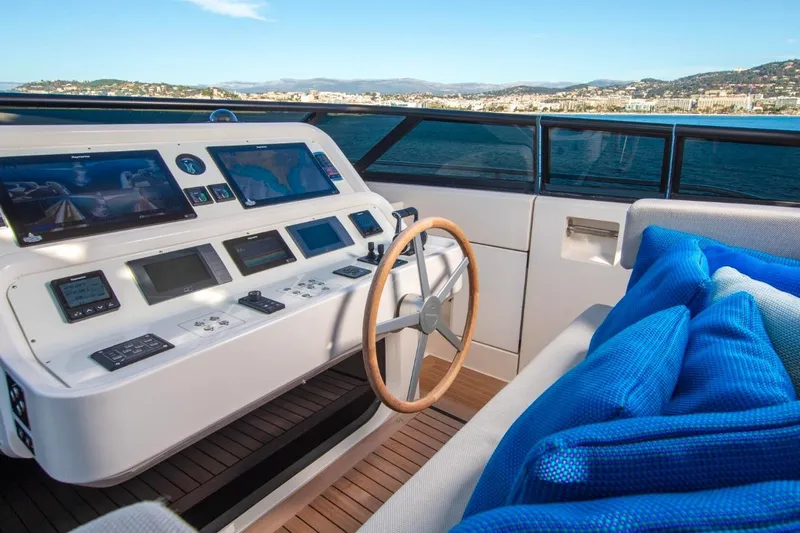 Sanlorenzo Sl118 Yacht Photos Pics Helm of 2021 Sanlorenzo SL118 yacht with navigation screens and blue cushions.