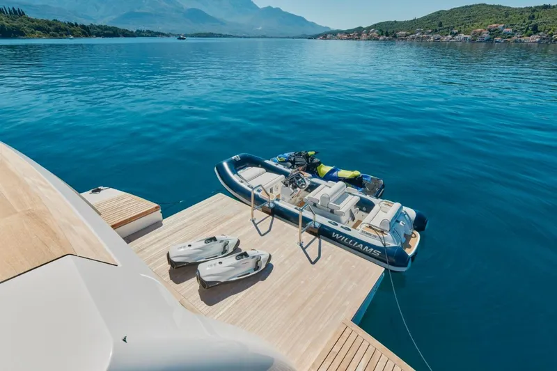 Sanlorenzo Sl118 Yacht Photos Pics Sanlorenzo SL118 yacht with tender and jet skis on serene blue water, 2021 model.