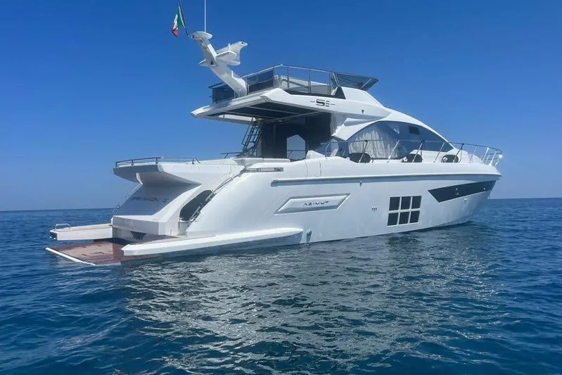  Yacht Photos Pics 2023 Azimut S6 Sportfly yacht on calm blue sea under clear sky.