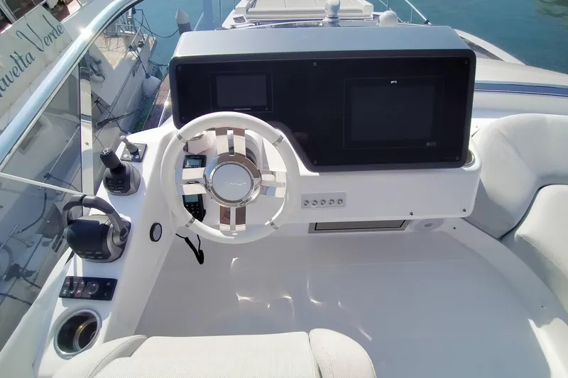  Yacht Photos Pics 2023 Azimut S6 Sportfly helm with modern controls and navigation screens.