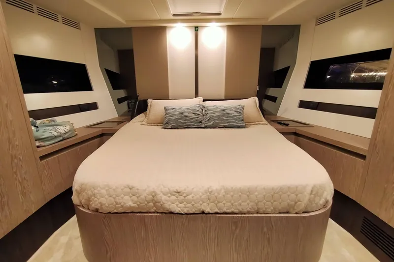  Yacht Photos Pics Luxurious bedroom interior of 2023 Azimut S6 Sportfly yacht with modern design elements.