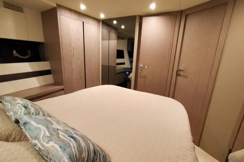  Yacht Photos Pics Luxurious bedroom interior of 2023 Azimut S6 Sportfly yacht with modern design elements.