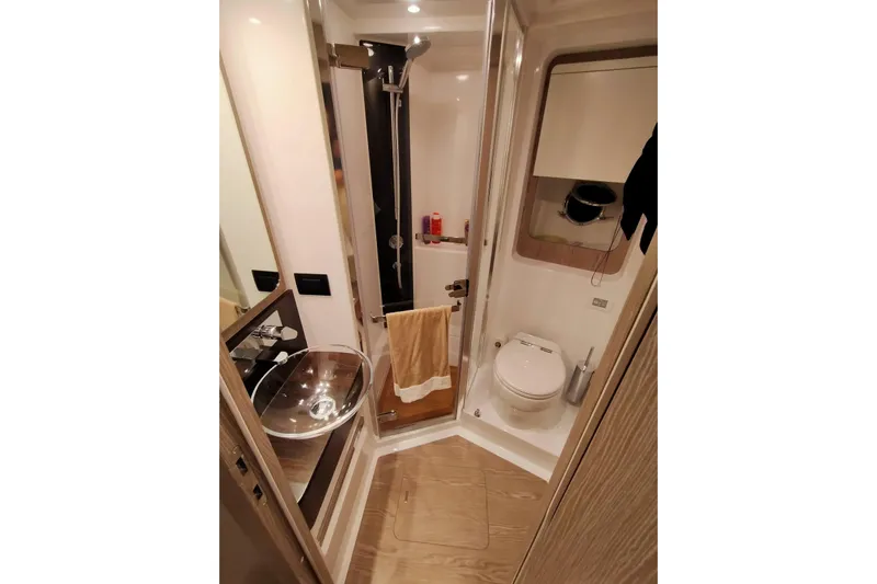  Yacht Photos Pics Luxurious bathroom in 2023 Azimut S6 Sportfly yacht with modern fixtures.