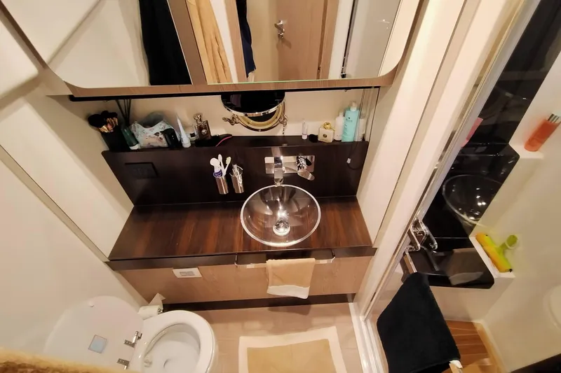  Yacht Photos Pics Luxurious bathroom in 2023 Azimut S6 Sportfly yacht with modern fixtures and elegant design.