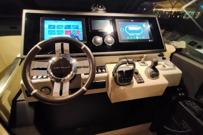  Yacht Photos Pics 2023 Azimut S6 Sportfly helm with advanced navigation displays and controls.