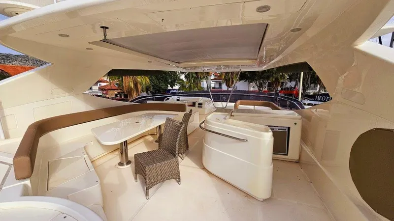  Yacht Photos Pics Luxurious 2012 Ferretti Yachts 881 deck with seating and dining area.