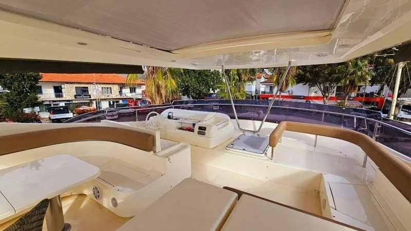  Yacht Photos Pics Luxurious 2012 Ferretti Yachts 881 flybridge with elegant seating and helm station.