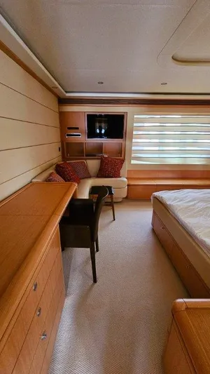  Yacht Photos Pics Luxurious cabin interior of 2012 Ferretti Yachts 881 with elegant wood finishes.