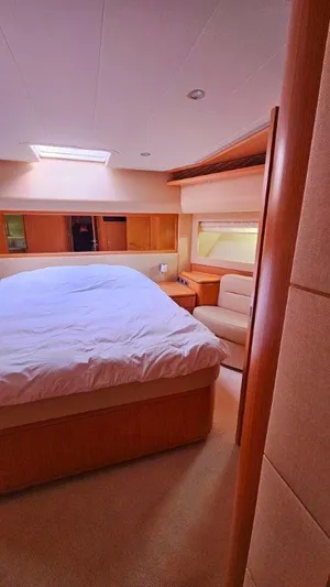  Yacht Photos Pics Luxurious bedroom interior of 2012 Ferretti Yachts 881 with cozy bed and elegant furnishings.