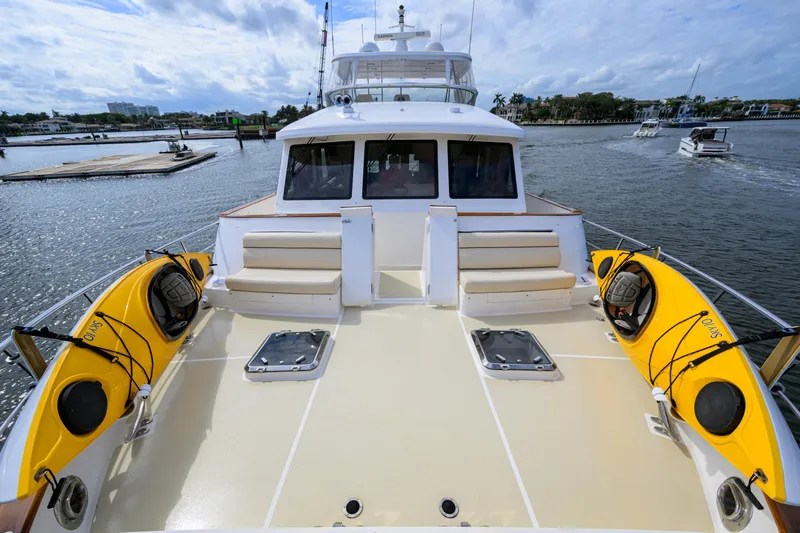 Monkey Business Yacht Photos Pics 2007 Grand Banks 59 Aleutian RP yacht deck with kayaks and seating area.