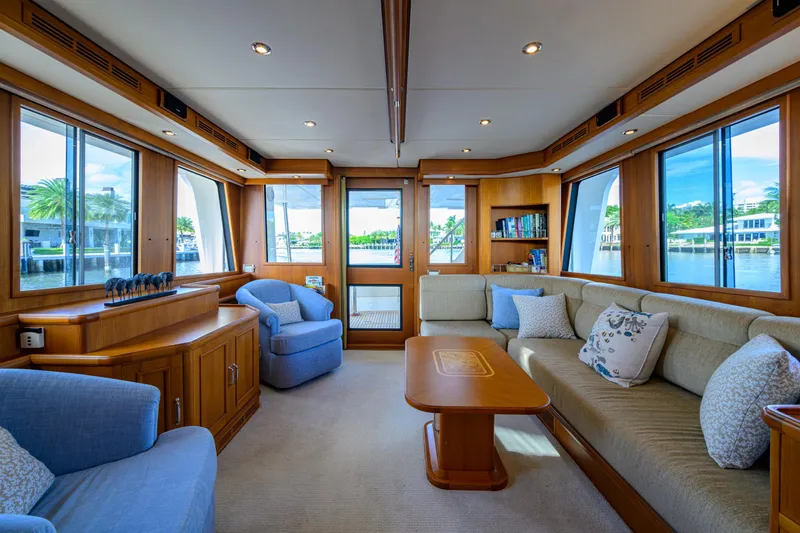 Monkey Business Yacht Photos Pics Luxurious interior of 2007 Grand Banks 59 Aleutian RP yacht with elegant seating and panoramic windows.