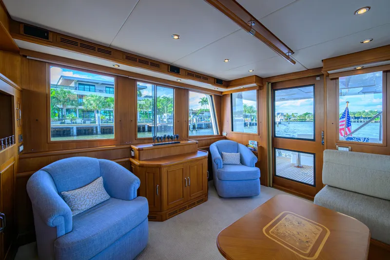 Monkey Business Yacht Photos Pics Luxurious interior of 2007 Grand Banks 59 Aleutian RP yacht with plush seating and scenic windows.