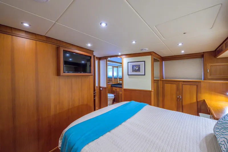 Monkey Business Yacht Photos Pics Luxurious 2007 Grand Banks 59 Aleutian RP yacht cabin with wood paneling and modern amenities.