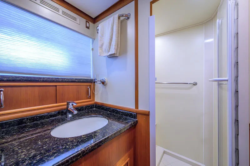 Monkey Business Yacht Photos Pics Luxurious bathroom in 2007 Grand Banks 59 Aleutian RP yacht with granite countertop and shower.