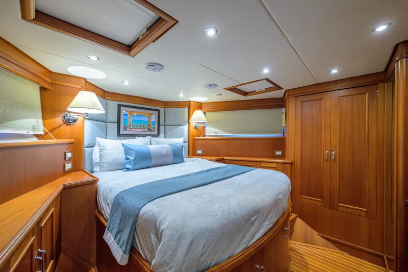 Monkey Business Yacht Photos Pics Luxurious 2007 Grand Banks 59 Aleutian RP yacht bedroom with elegant wood finish.