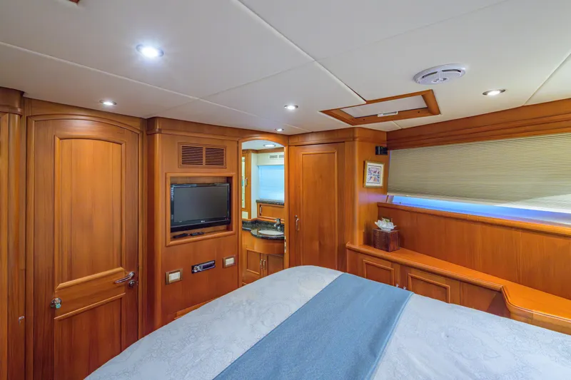 Monkey Business Yacht Photos Pics Luxurious 2007 Grand Banks 59 Aleutian RP yacht cabin with wood paneling and modern amenities.