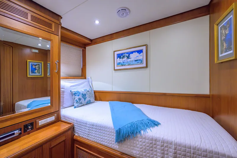Monkey Business Yacht Photos Pics Luxurious cabin interior of 2007 Grand Banks 59 Aleutian RP yacht with cozy bedding.