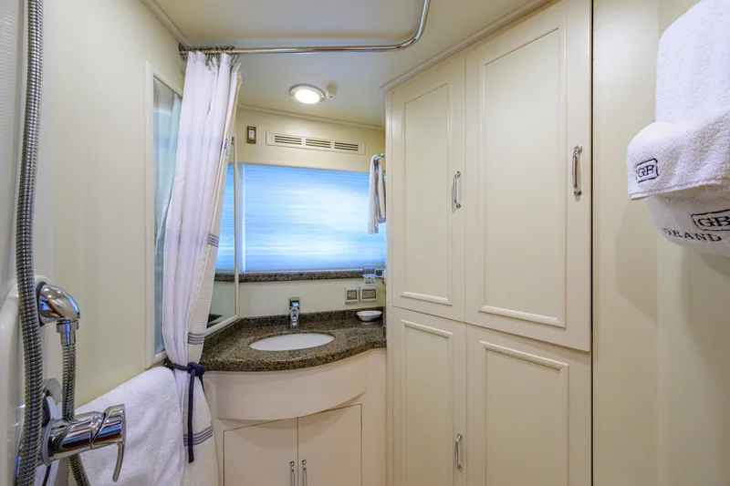 Monkey Business Yacht Photos Pics Luxurious bathroom in 2007 Grand Banks 59 Aleutian RP yacht with elegant fixtures.